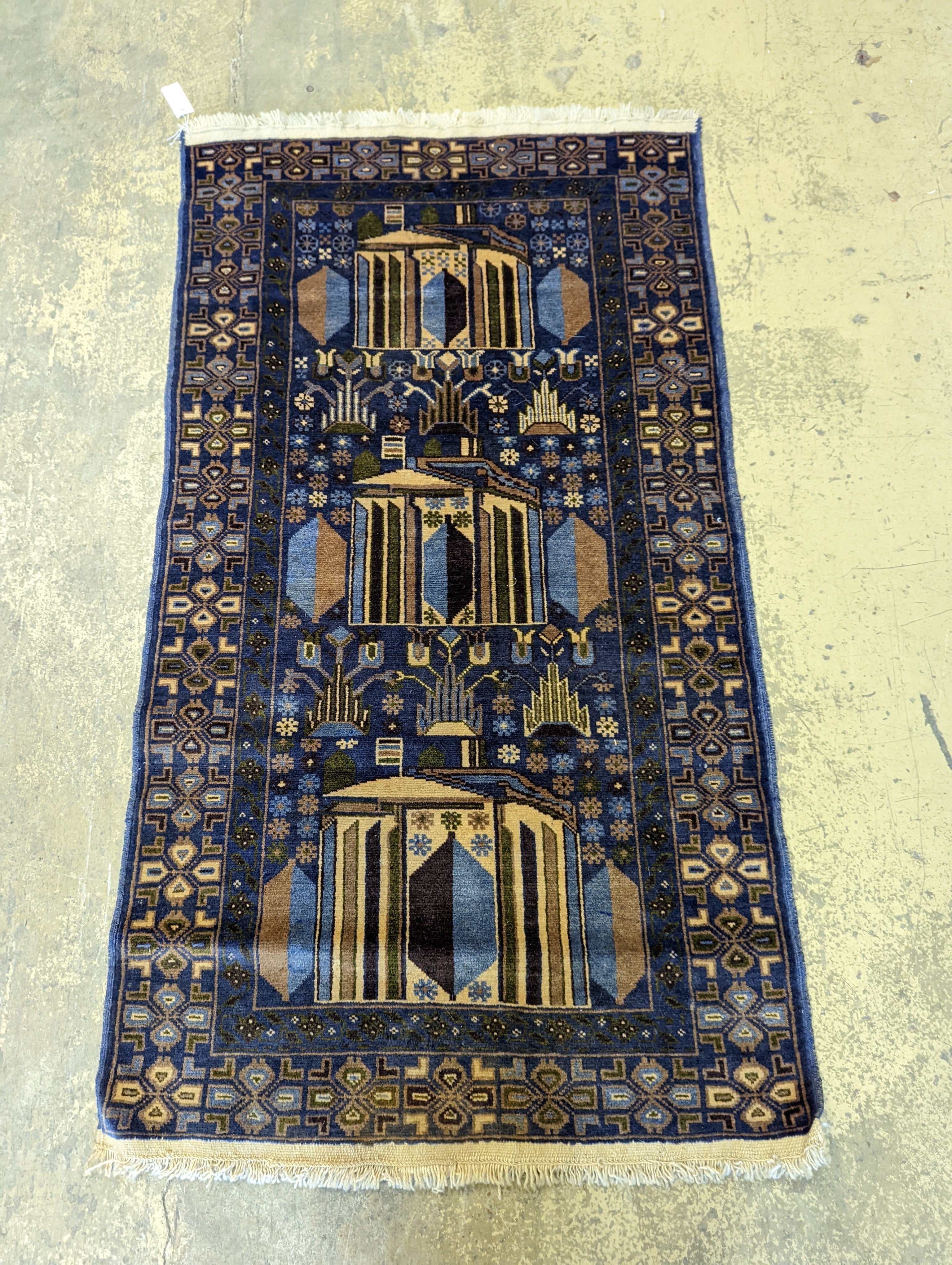 A Caucasian design blue ground rug, 145 x 84cm